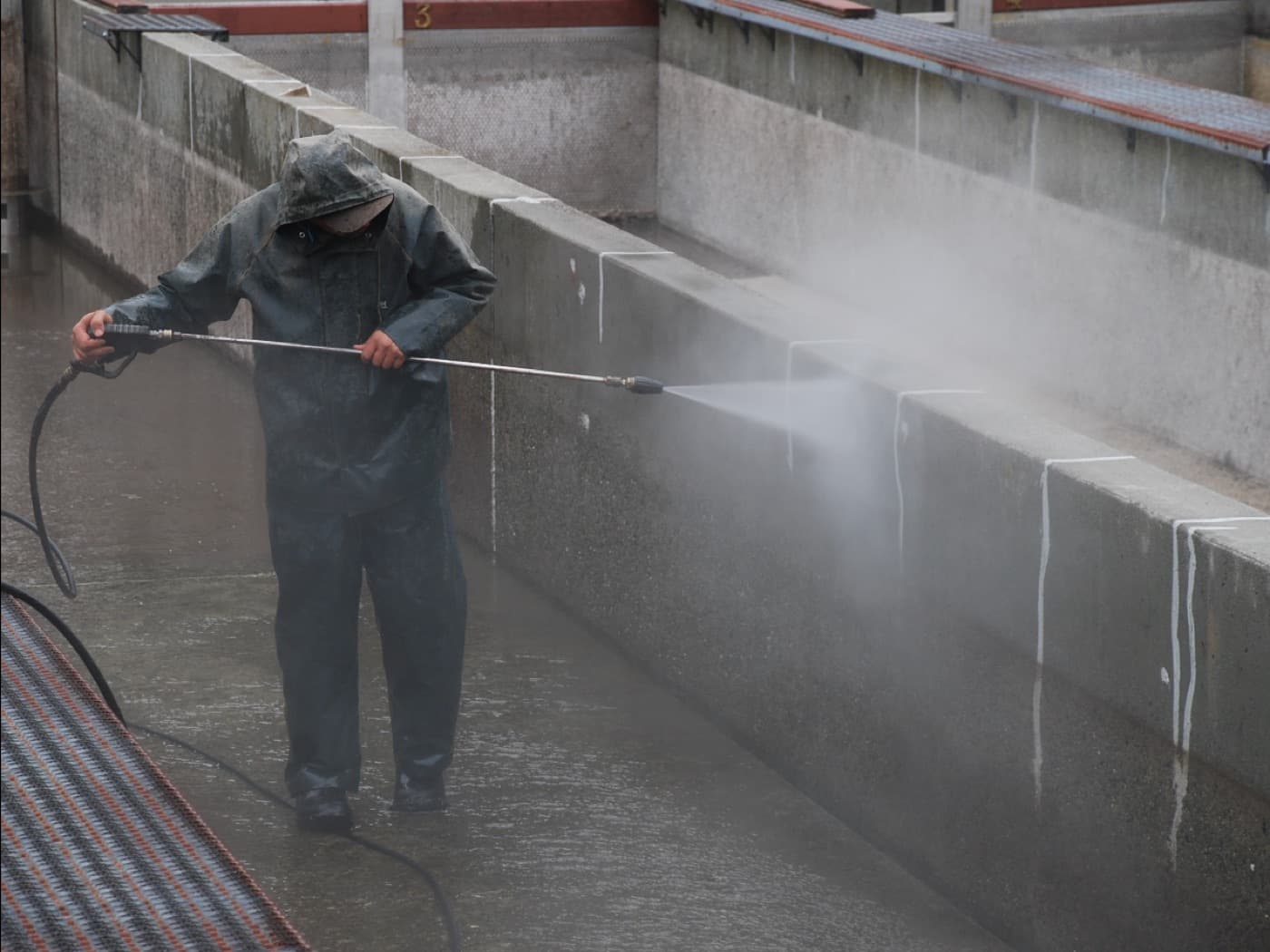 Our team applying waterproof coating on a terrace